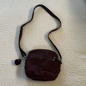 Burgundy Kipling shoulder bag. Like new condition.